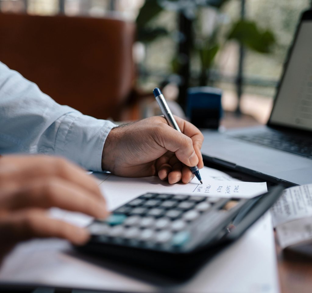 Malaysian SME owner reviewing cost of hiring a full-time sales team